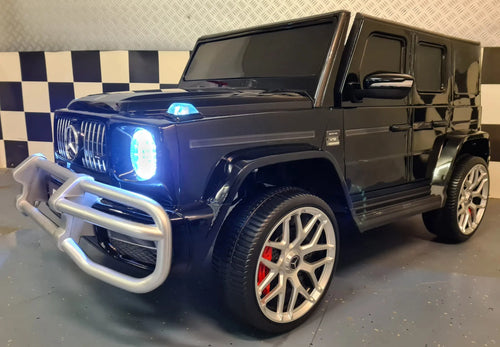 Mercedes G63 AMG 2-Sitzer Kinder Elektroauto lizenziert in weiß oder schwarz – Leder, 8km/h, EVA, Fernbedienung, MP3, Stoßdämpfer