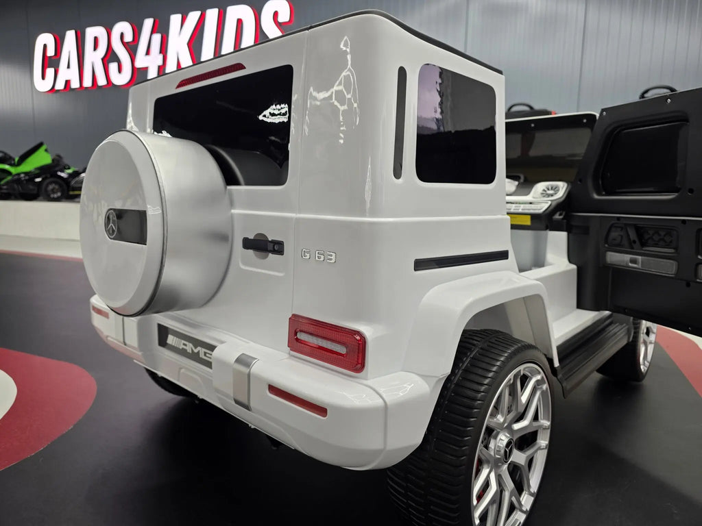 Mercedes G63 AMG 2-Sitzer Kinder Elektroauto lizenziert in weiß oder schwarz – Leder, 8km/h, EVA, Fernbedienung, MP3, Stoßdämpfer