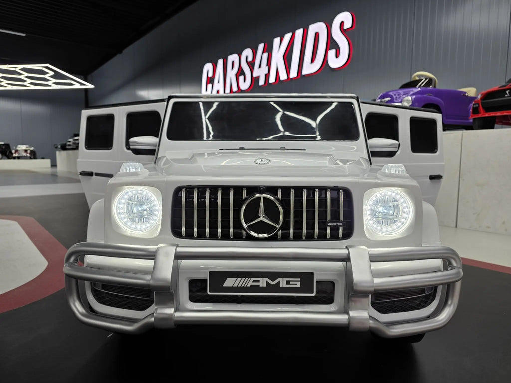 Mercedes G63 AMG 2-Sitzer Kinder Elektroauto lizenziert in weiß oder schwarz – Leder, 8km/h, EVA, Fernbedienung, MP3, Stoßdämpfer