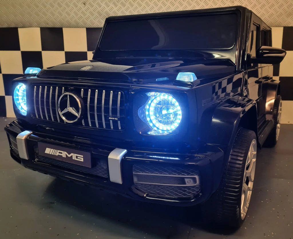 Mercedes G63 AMG 2-Sitzer Kinder Elektroauto lizenziert in weiß oder schwarz – Leder, 8km/h, EVA, Fernbedienung, MP3, Stoßdämpfer