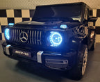 Mercedes G63 AMG 2-Sitzer Kinder Elektroauto lizenziert in weiß oder schwarz – Leder, 8km/h, EVA, Fernbedienung, MP3, Stoßdämpfer