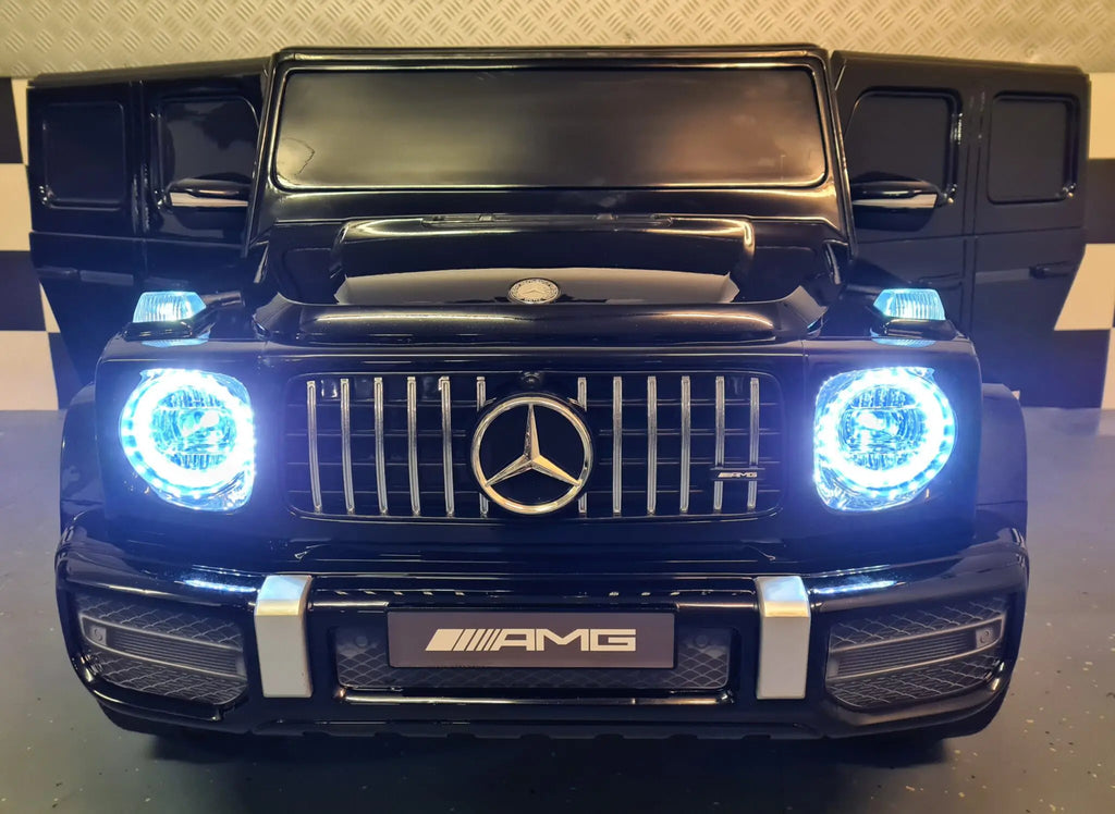 Mercedes G63 AMG 2-Sitzer Kinder Elektroauto lizenziert in weiß oder schwarz – Leder, 8km/h, EVA, Fernbedienung, MP3, Stoßdämpfer