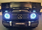 Mercedes G63 AMG 2-Sitzer Kinder Elektroauto lizenziert in weiß oder schwarz – Leder, 8km/h, EVA, Fernbedienung, MP3, Stoßdämpfer