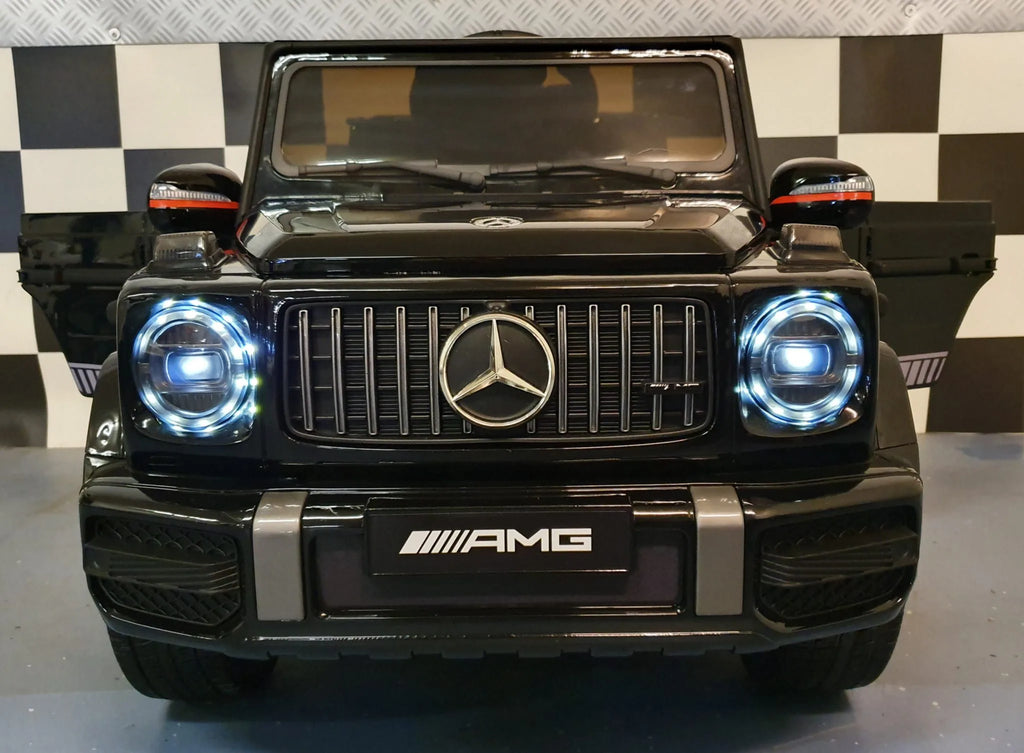 Mercedes G63 AMG in Schwarz – Kinder Elektroauto lizenziert mit Ledersitzen, Vollgummireifen, Fernbedienung, MP3, Stoßdämpfer
