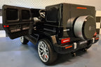 Mercedes G63 AMG 2-Sitzer Kinder Elektroauto lizenziert in weiß oder schwarz – Leder, 8km/h, EVA, Fernbedienung, MP3, Stoßdämpfer