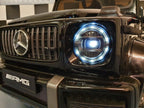 Mercedes G63 AMG in Schwarz – Kinder Elektroauto lizenziert mit Ledersitzen, Vollgummireifen, Fernbedienung, MP3, Stoßdämpfer