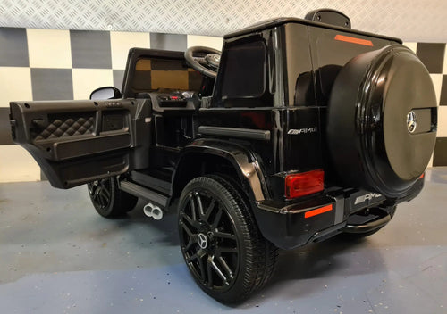 Mercedes G63 AMG in Schwarz – Kinder Elektroauto lizenziert mit Ledersitzen, Vollgummireifen, Fernbedienung, MP3, Stoßdämpfer