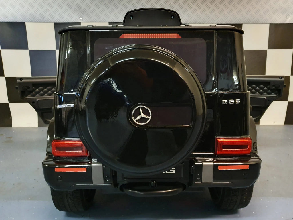 Mercedes G63 AMG in Schwarz – Kinder Elektroauto lizenziert mit Ledersitzen, Vollgummireifen, Fernbedienung, MP3, Stoßdämpfer
